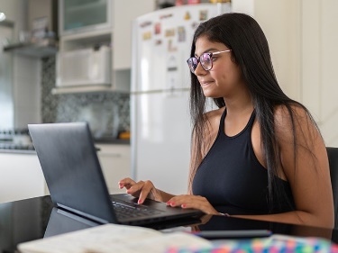 A woman using a laptop. 