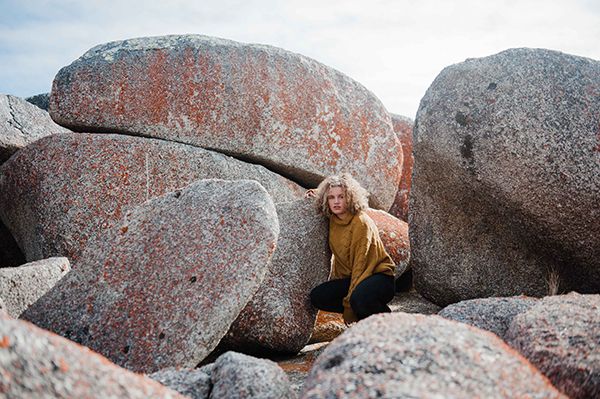 Picture of Jayda sitting near rocks