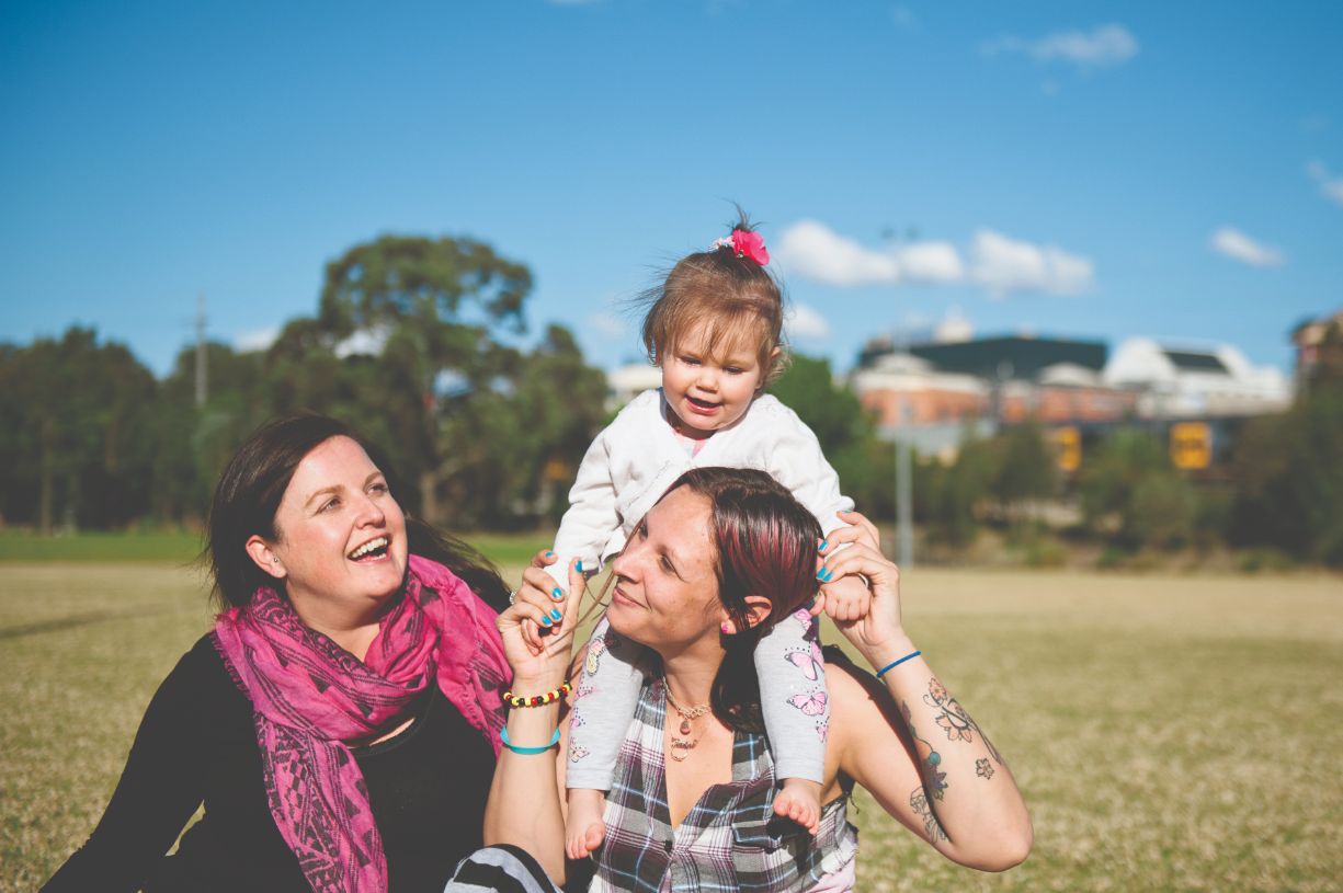 A picture of Rhani, her daughter, and her caseworker Narelle