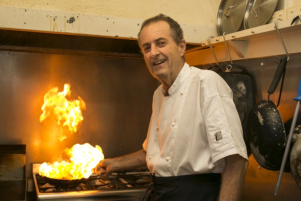  Franciso Da Costa in his kitchen cooking a fiery dish
